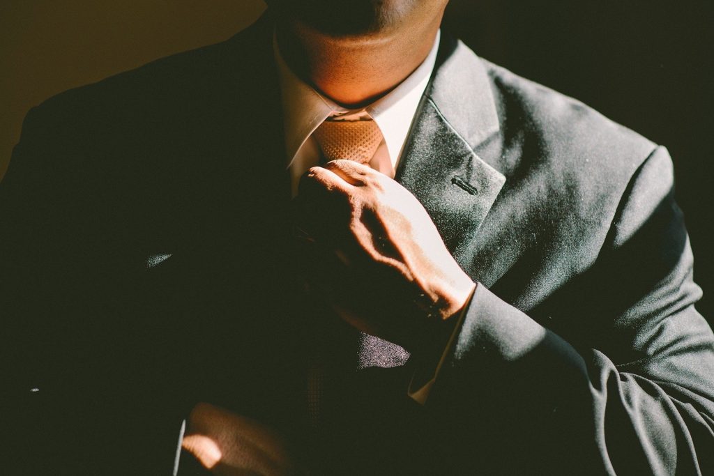 A man wearing a suit and tie