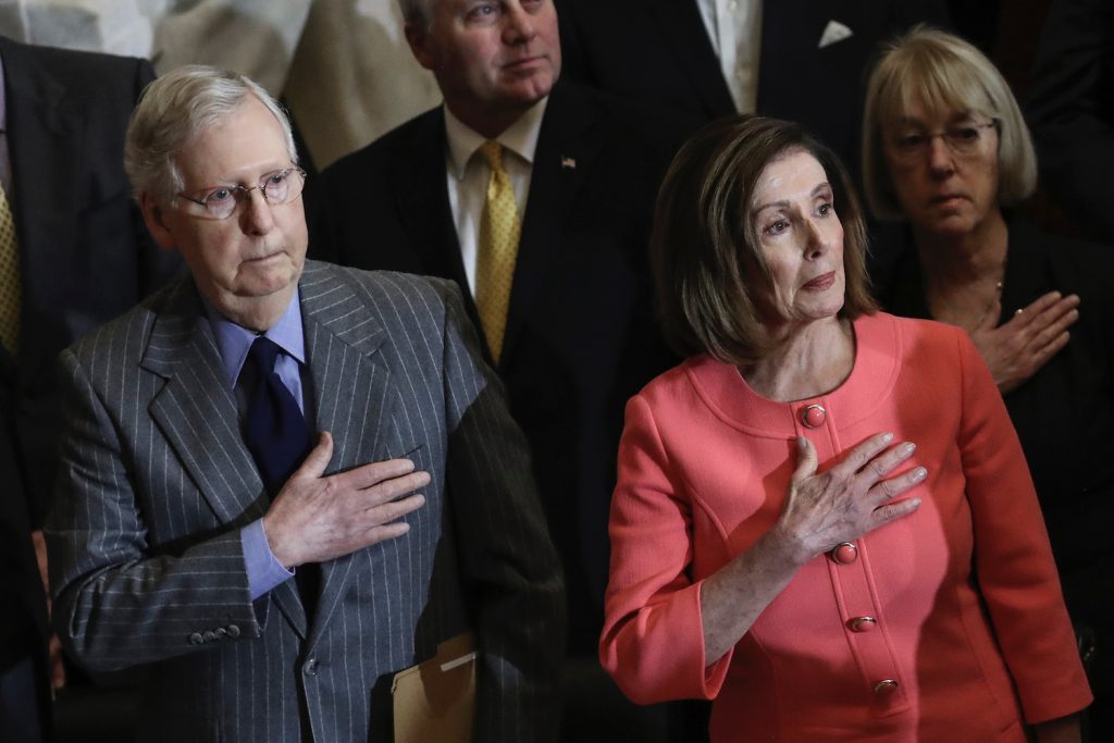 Mitch McConnell, Patty Murray standing next to a man in a suit and tie