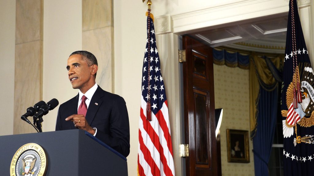 Barack Obama wearing a suit and tie