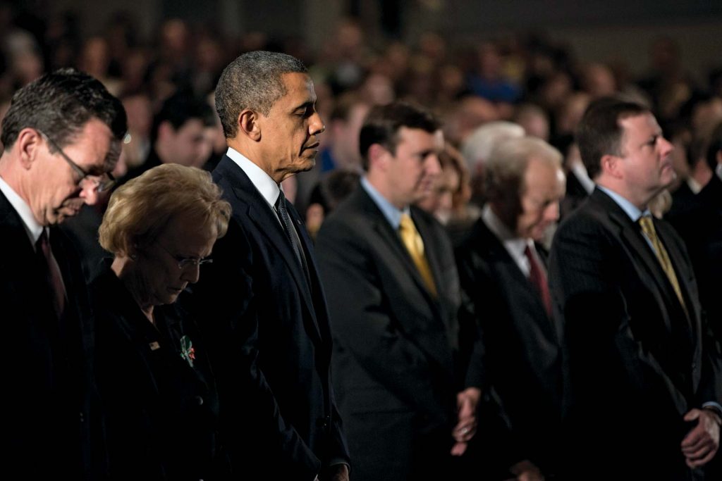 A group of people standing in front of a crowd