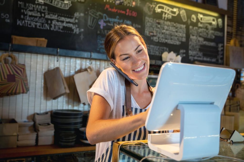 A person standing in front of a laptop