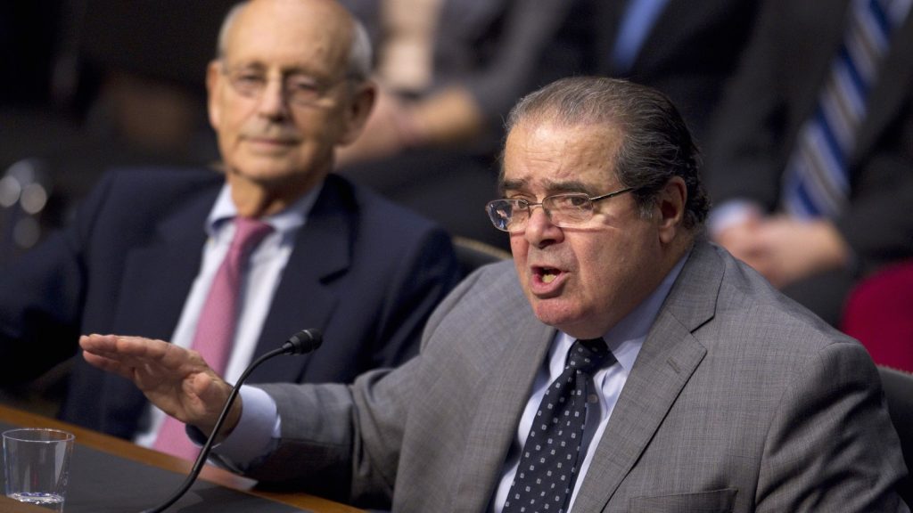 Stephen Breyer, Antonin Scalia are posing for a picture