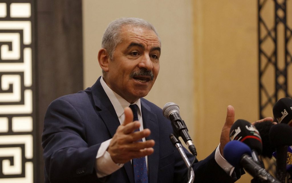 Mohammad Shtayyeh wearing a suit and tie