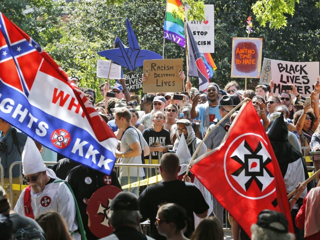 A group of people standing in front of a crowd